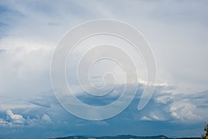 Beautifuly clear blue sky with layers of white clouds flying by