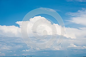 Beautifuly clear blue sky with layers of white clouds flying by