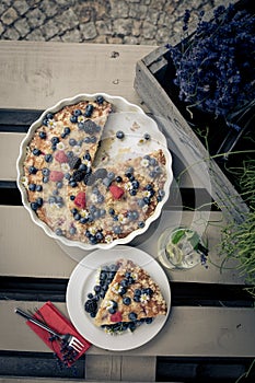 Beautifuly decorated cake with flowers and forest fruit photo