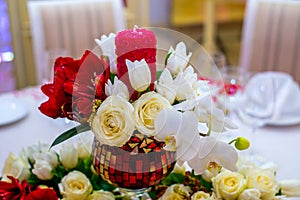 Beautifuly decorated wedding reception table covered with fresh flowers