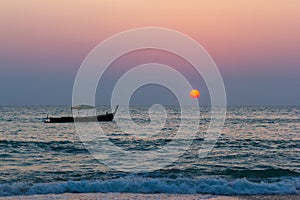 Beautifuly Landscapes view Storm Wave and Little boat in the sea with sunsets twilight