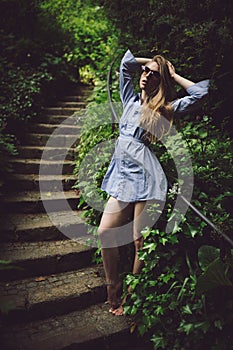 Beautilful young girl posing on stairs outdoors