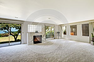 Beautitful living room with fireplace and walkout deck