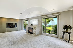 Beautitful living room with fireplace and walkout deck