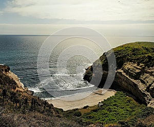 A beautiul beach surrounded by cliffs