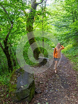 Beauty adult woman walk in a forest