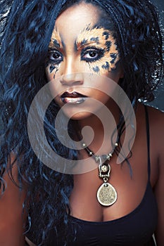 Beauty afro girl with cat make up, creative leopard print closeup, fashion style halloween look