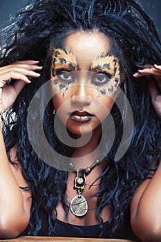 Beauty afro girl with cat make up, creative leopard print closeup, fashion style halloween look