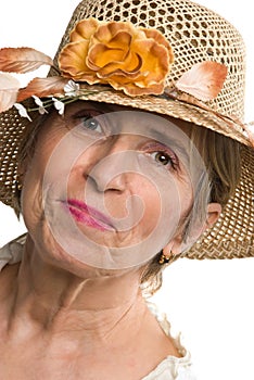 Beauty aged senior woman with summer hat