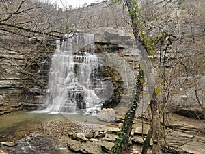 beauty of Alferello waterfall enveloped in the warm and embracing tones of autumn