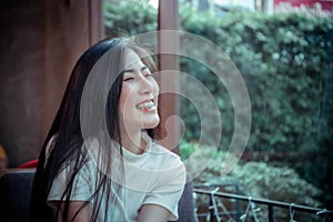 Beauty asian girl`s smiling and looing at happy emotion day