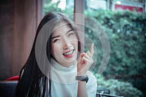 Beauty asian girl`s smiling and looing at happy emotion day photo