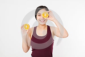 Beauty asian japanese woman hold Oranges.Beauty concept. Beautiful Joyful teen girl with freckles, funny red hairstyle and yellow