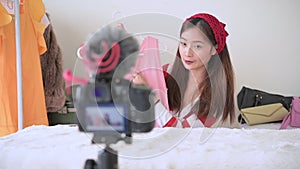 Beauty Asian Vlogger blogger interview with professional DSLR digital camera film video live. Woman coaching trading and review