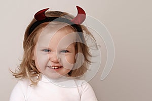 Beauty baby girl. Halloween background with happy kid and space, funny child, cute little girl with costume