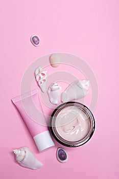 Beauty background with facial cosmetic products with empty copy space. Makeup, skin care concept with pastel colored