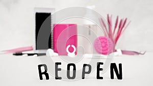 A beauty background with focus on the word REOPEN