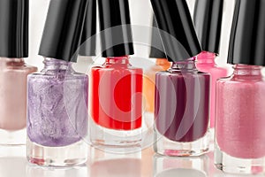 beauty background of nail polish of different colors close up