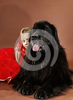 Beauty and the Beast. Girl with big black water-dog.