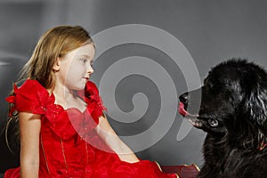 Beauty and the Beast. Girl with big black water-dog.