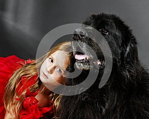 Beauty and the Beast. Girl with big black water-dog.