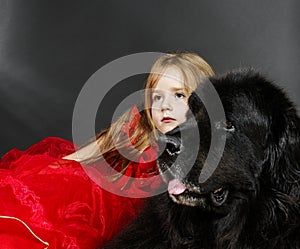 Beauty and the Beast. Girl with big black water-dog.