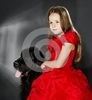 Beauty and the Beast. Girl with big black water-dog.