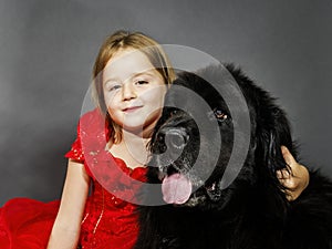 Beauty and the Beast. Girl with big black water-dog.
