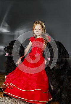 Beauty and the Beast. Girl with big black water-dog.