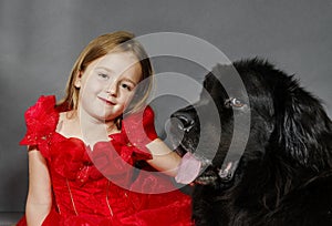 Beauty and the Beast. Girl with big black water-dog.