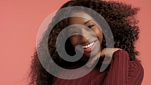 Beauty black mixed race african american woman with long curly hair and perfect smile