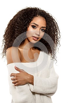 Beauty black skin woman African Ethnic female face. Young african american model with long afro hair.Smiling model isolated on