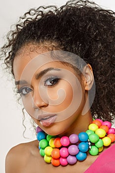 Beauty black skin woman fashion african ethnic female face portrait. Young girl model with afro and extraordinary brightly colored