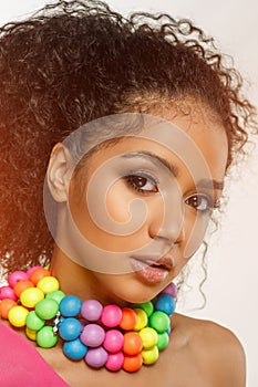 Beauty black skin woman fashion african ethnic female face portrait. Young girl model with afro and extraordinary brightly colored