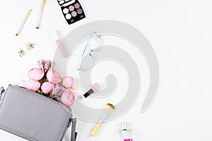 Beauty blog concept flat lay. Fashion accessories, flowers, cosmetics, jewelry, copyspace.