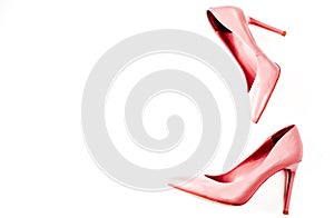 Beauty blog concept. pink nude female shoeson white background. Flat lay, top view trendy fashion feminine background.