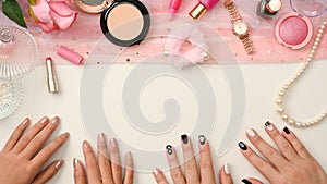 Beauty blogger, nail technician workspace with female hands with nails polished