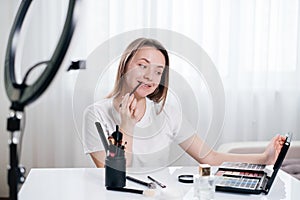 beauty blogger Recording Video about make-up and cosmetics