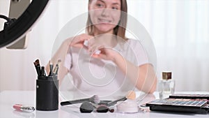 beauty blogger Recording Video about make-up and cosmetics