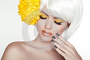 Beauty Blond Female Portrait with yellow flowers. Beautiful Spa