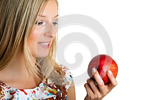 Beauty blond girl with apple