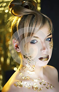 beauty blond woman with gold creative make up, luxury celebration
