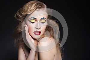 Beauty blonde woman portrait with creative pop art make up like