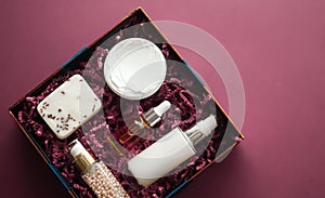 Beauty box subscription package and luxury skincare products, spa and cosmetic body care product flat lay on pink