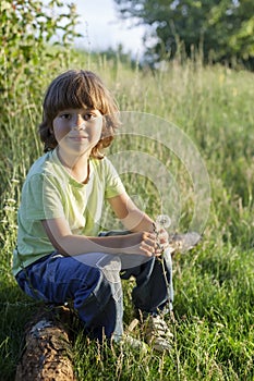 Beauty boy with dandelion