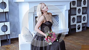 Beauty bride in bridal gown with bouquet and lace veil indoors