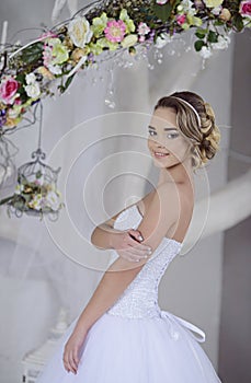 Beauty bride in bridal gown indoors