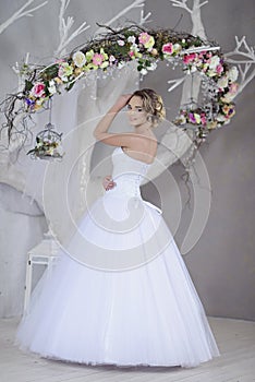 Beauty bride in bridal gown indoors