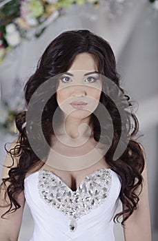 Beauty bride in bridal gown indoors