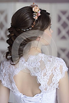 Beauty bride in bridal gown indoors